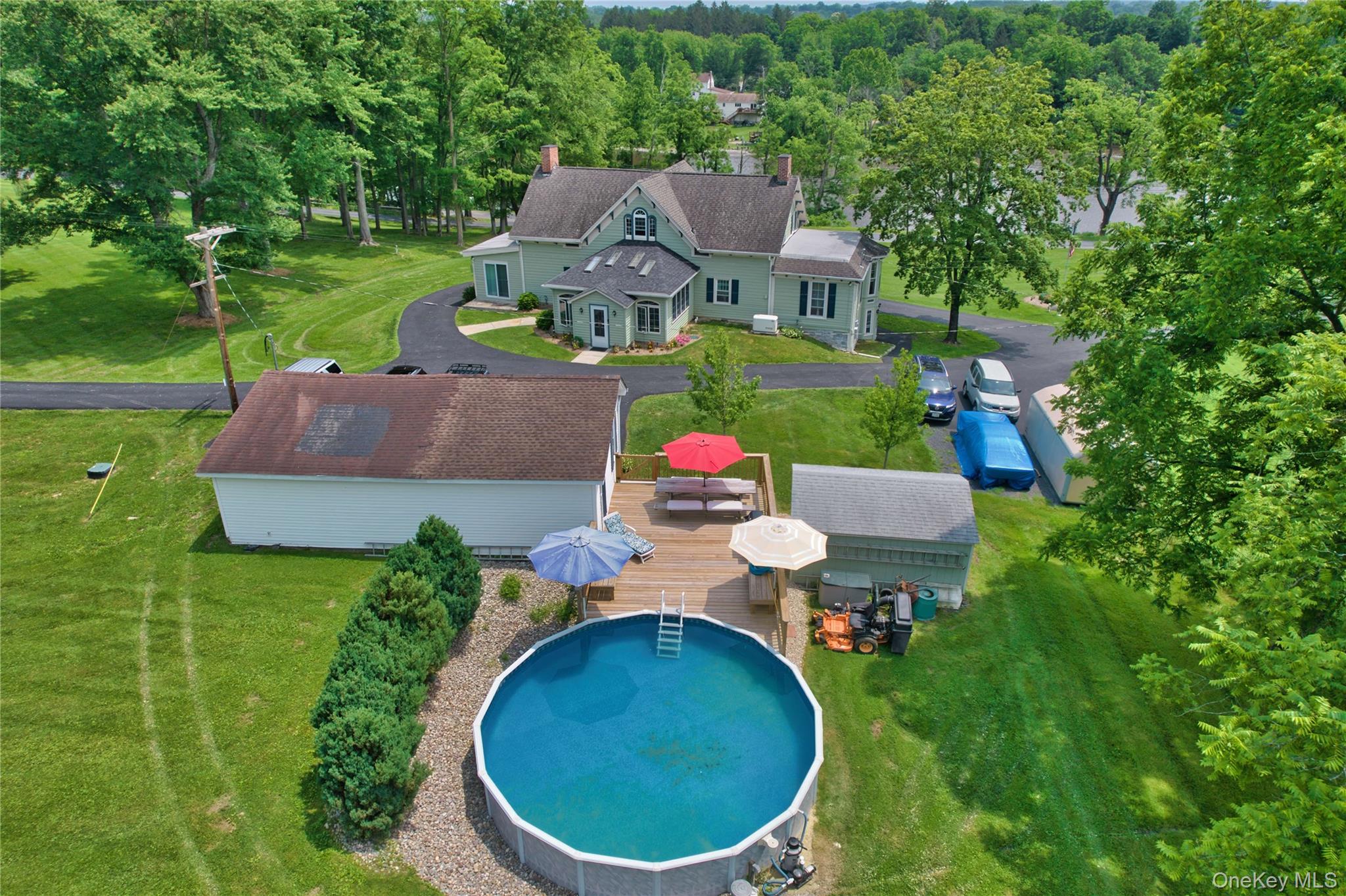 69 Lippincott Road Wallkill, NY 12589 - Photo 30 of 34 an aerial view of a house with swimming pool garden and patio