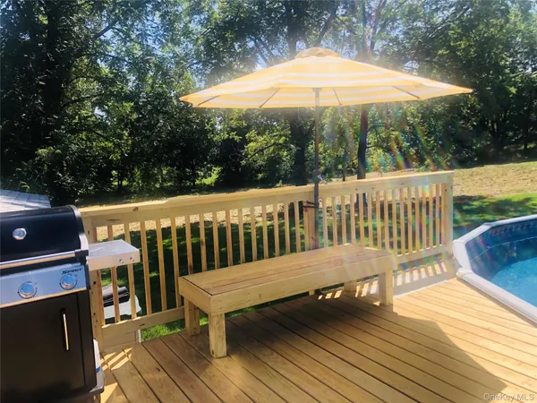 a view of a wooden deck with a patio