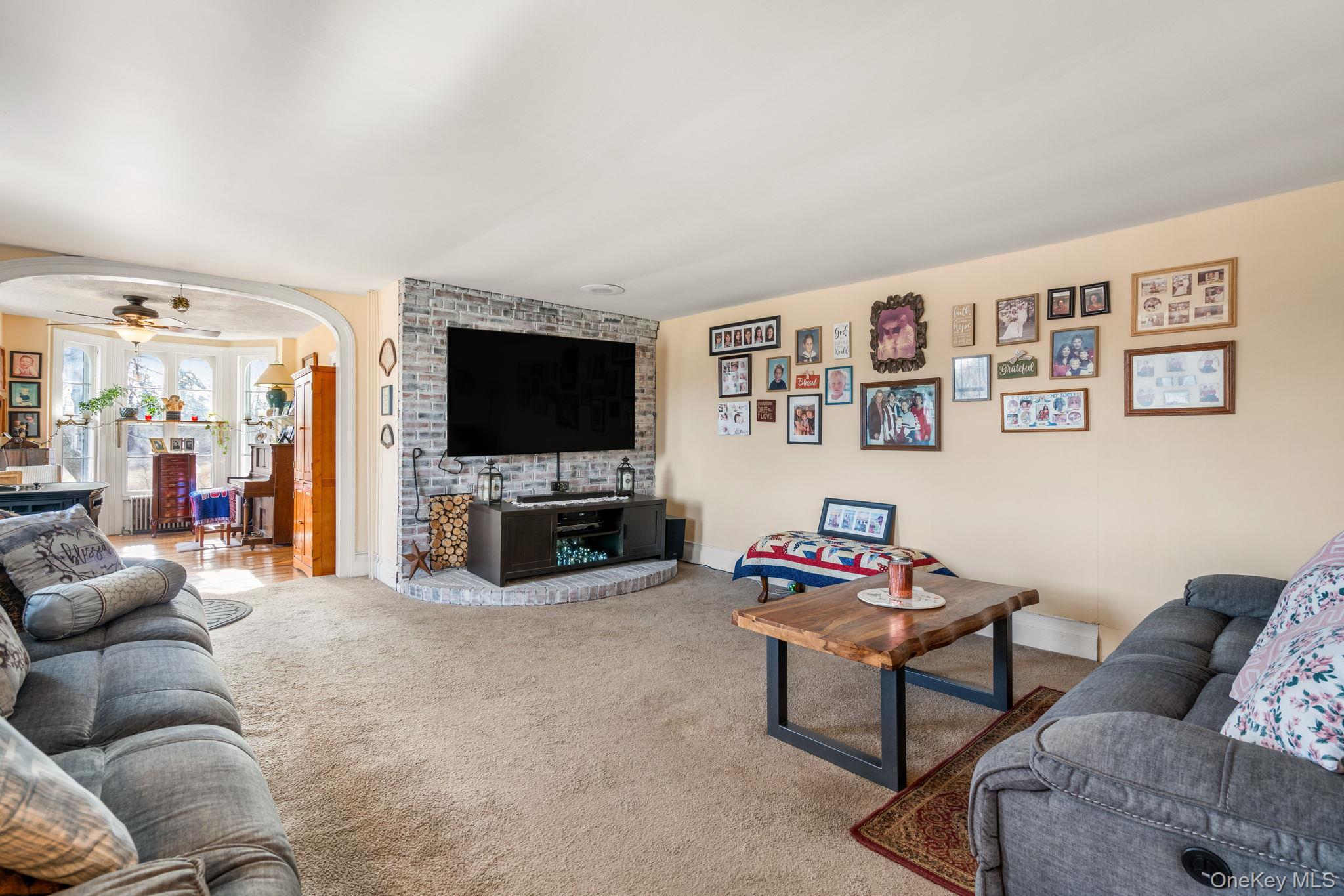 69 Lippincott Road Wallkill, NY 12589 - Photo 8 of 34 Living room featuring ceiling fan and light colored carpet