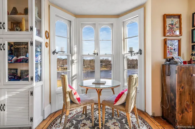 a living room with lots of furniture and a large window