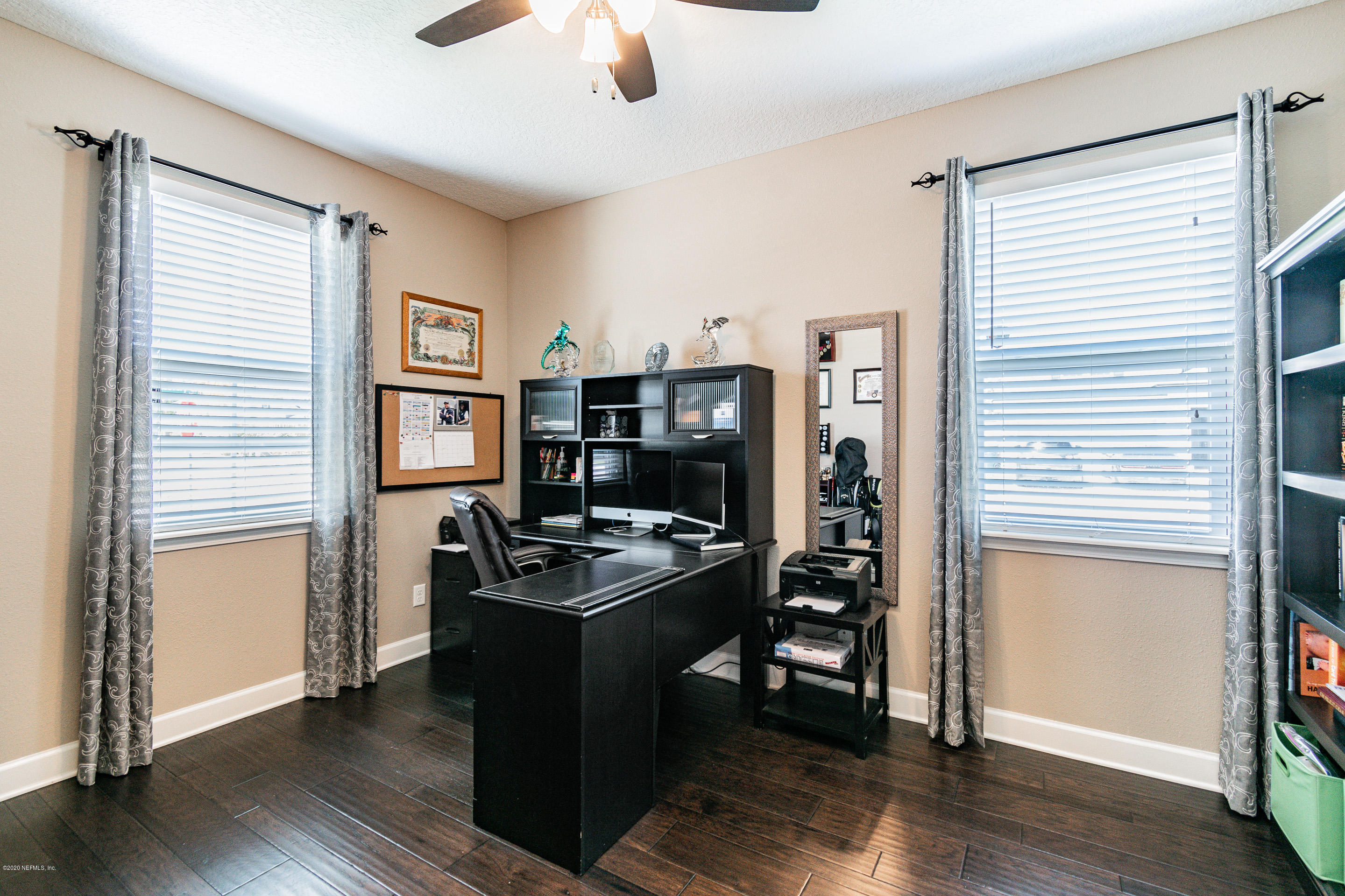 6737 Discovery Crossing Road Jacksonville, FL 32259 - Photo 13 of 51 a view of a workspace with furniture and a window