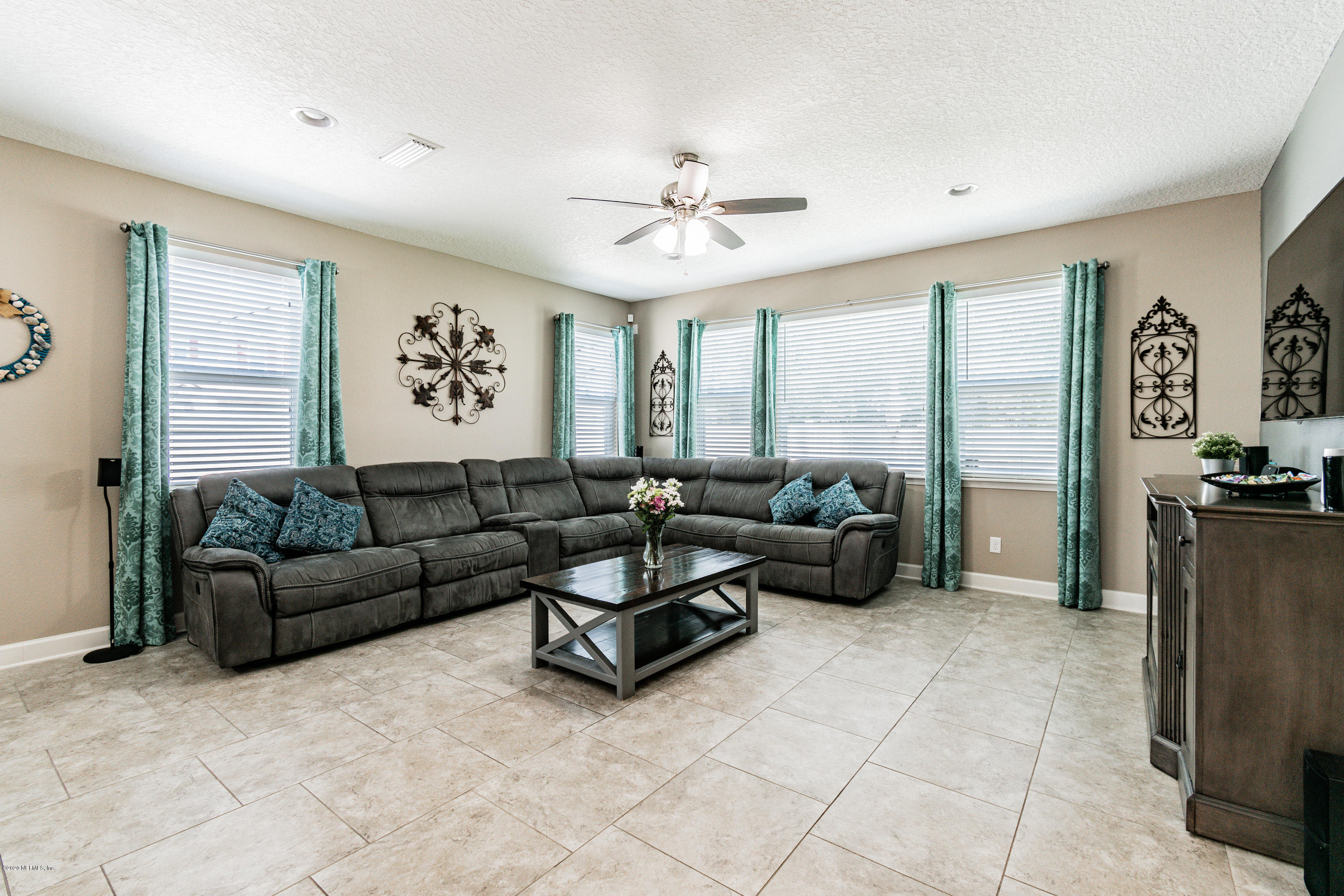 6737 Discovery Crossing Road Jacksonville, FL 32259 - Photo 21 of 51 a living room with furniture and a large window