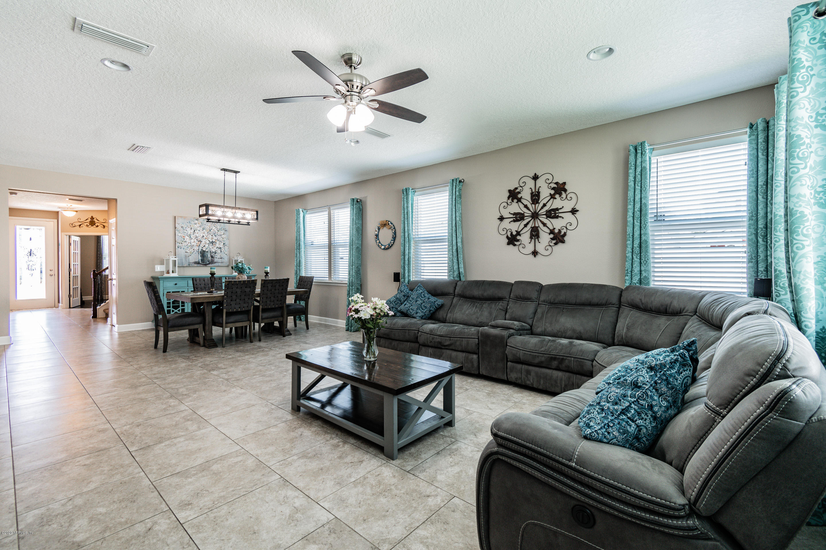 6737 Discovery Crossing Road Jacksonville, FL 32259 - Photo 22 of 51 a living room with furniture and a large window