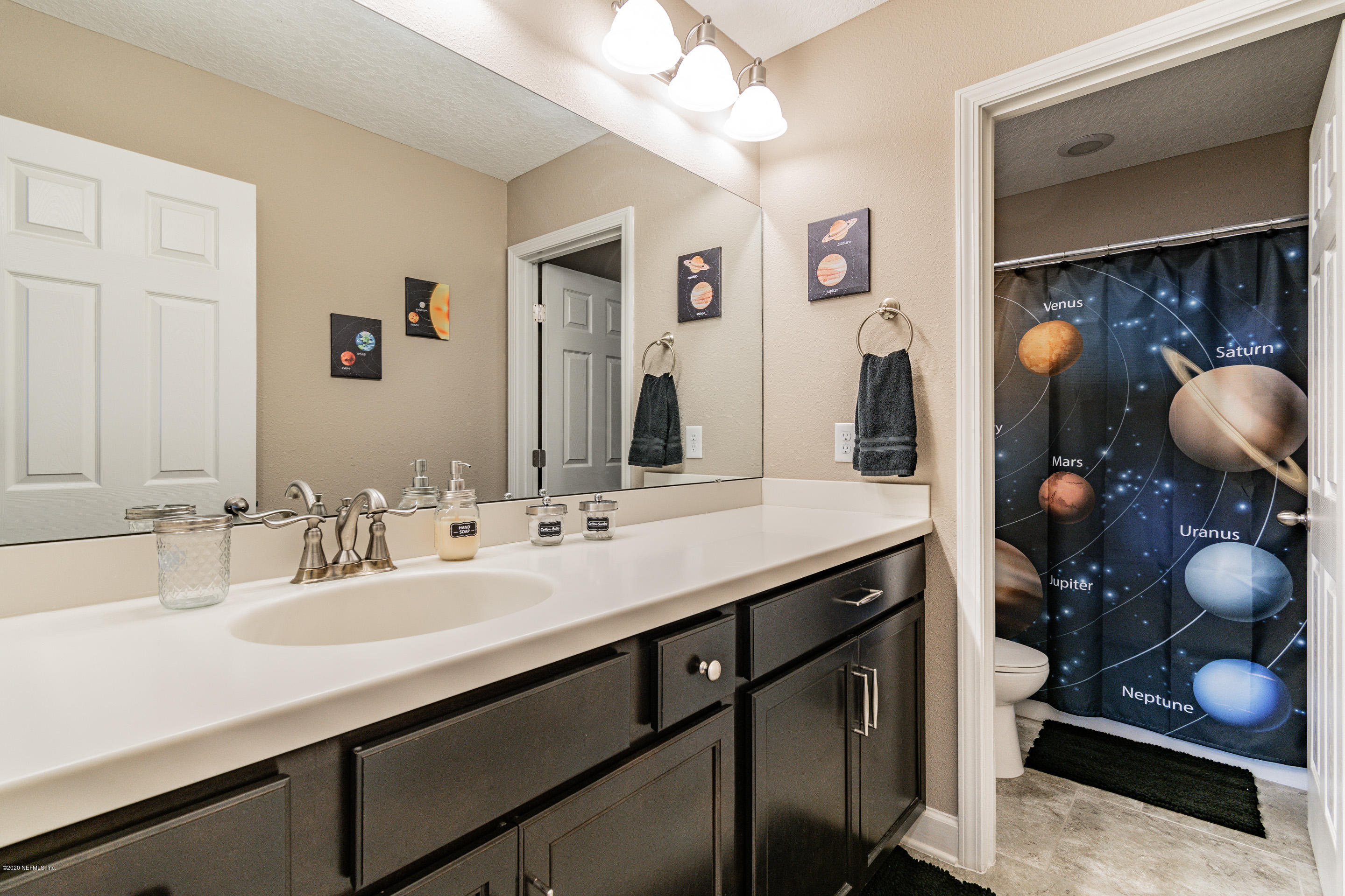 6737 Discovery Crossing Road Jacksonville, FL 32259 - Photo 30 of 51 a bathroom with a sink double vanity and a mirror