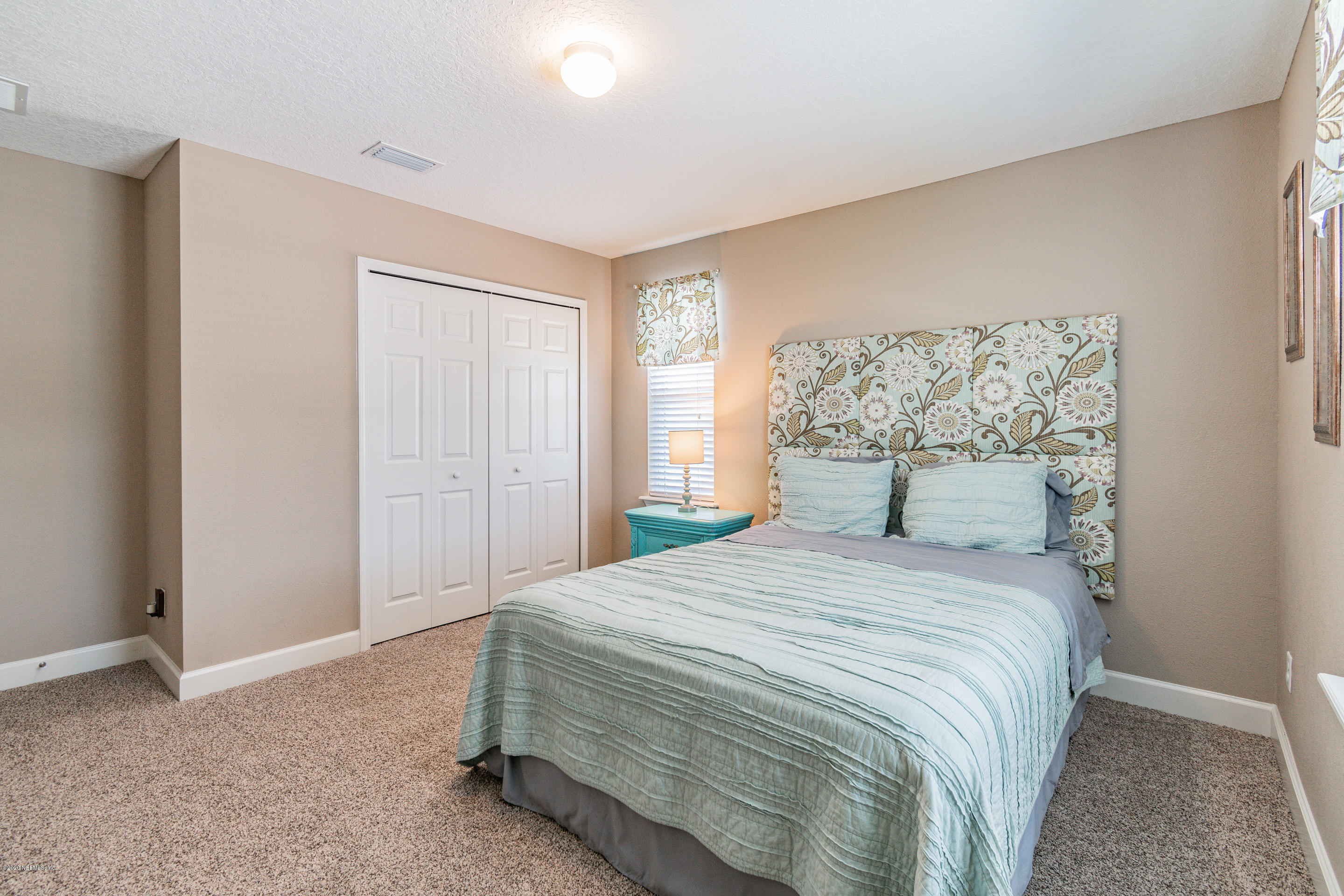 6737 Discovery Crossing Road Jacksonville, FL 32259 - Photo 34 of 51 a bedroom with a bed and a window