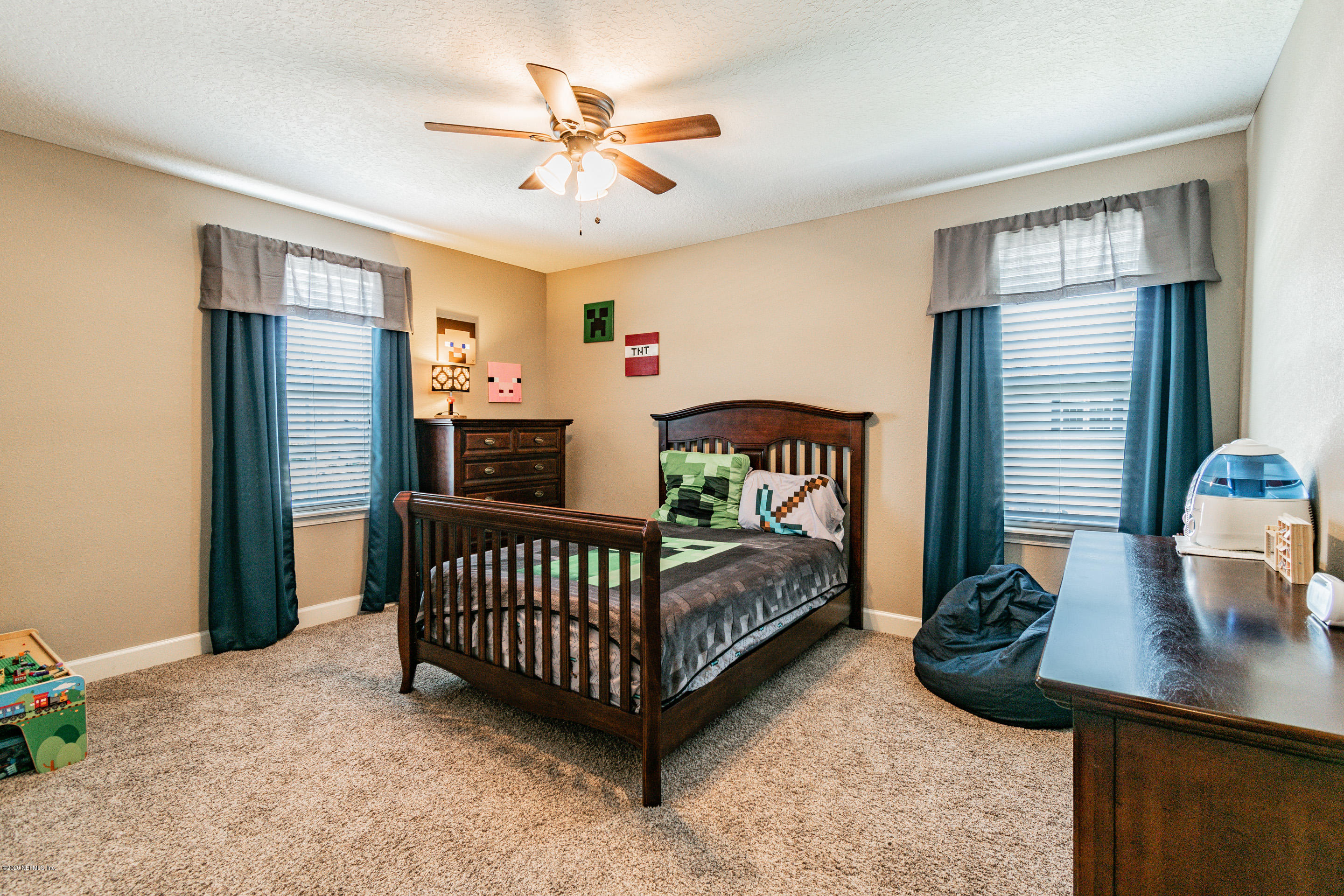 6737 Discovery Crossing Road Jacksonville, FL 32259 - Photo 36 of 51 a bed room with furniture and a window