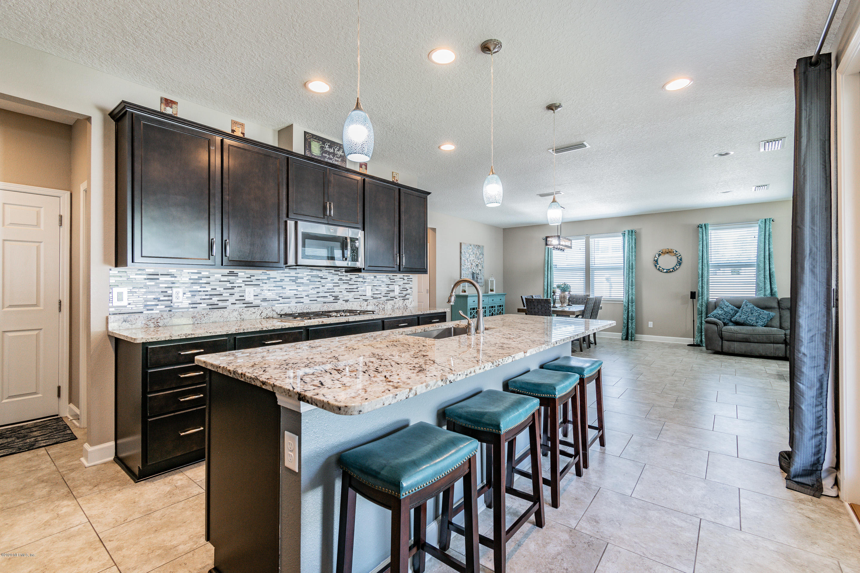 6737 Discovery Crossing Road Jacksonville, FL 32259 - Photo 4 of 51 a kitchen with a table and chairs in it