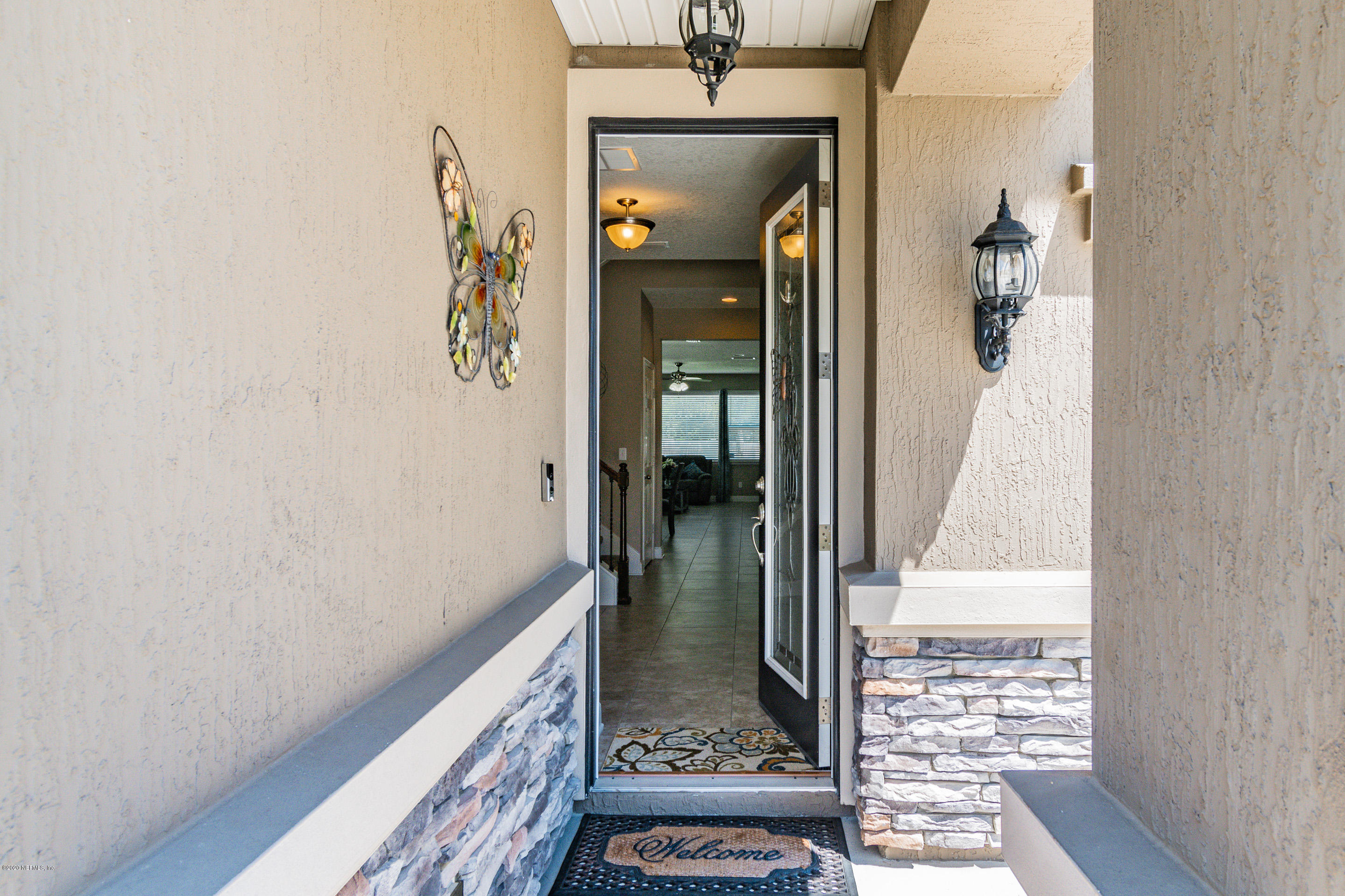 6737 Discovery Crossing Road Jacksonville, FL 32259 - Photo 48 of 51 a view of a hallway with wooden floor and a bathroom