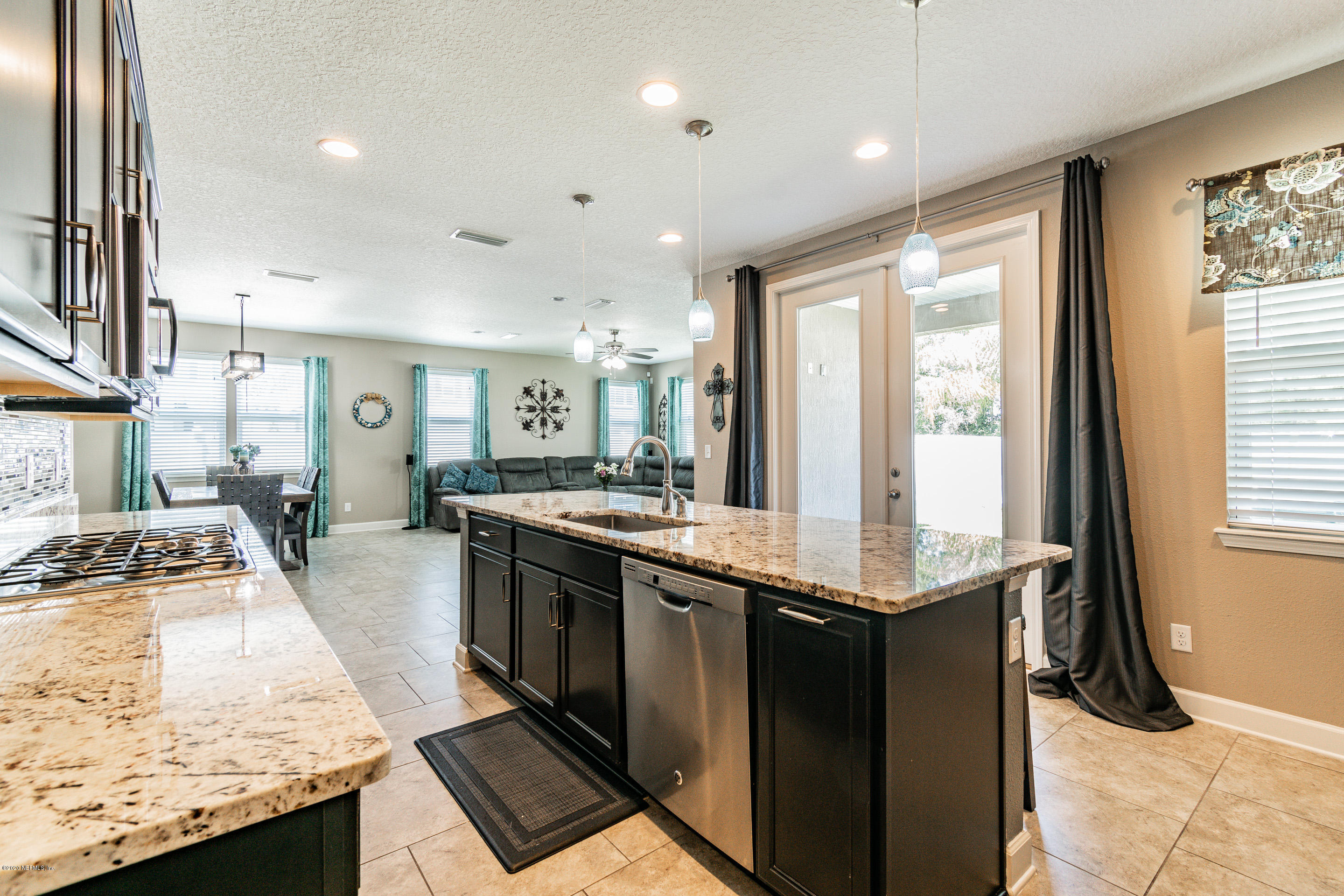 6737 Discovery Crossing Road Jacksonville, FL 32259 - Photo 5 of 51 a kitchen with stainless steel appliances granite countertop a stove and a sink
