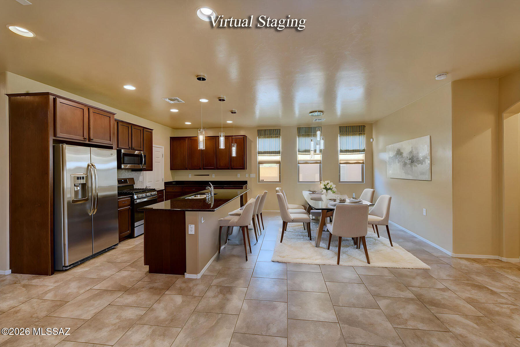 13991 East Cheavront Loop Vail, AZ 85641 - Photo 4 of 47 a kitchen with stainless steel appliances granite countertop a stove top oven a sink dishwasher a dining table and chairs with wooden floor