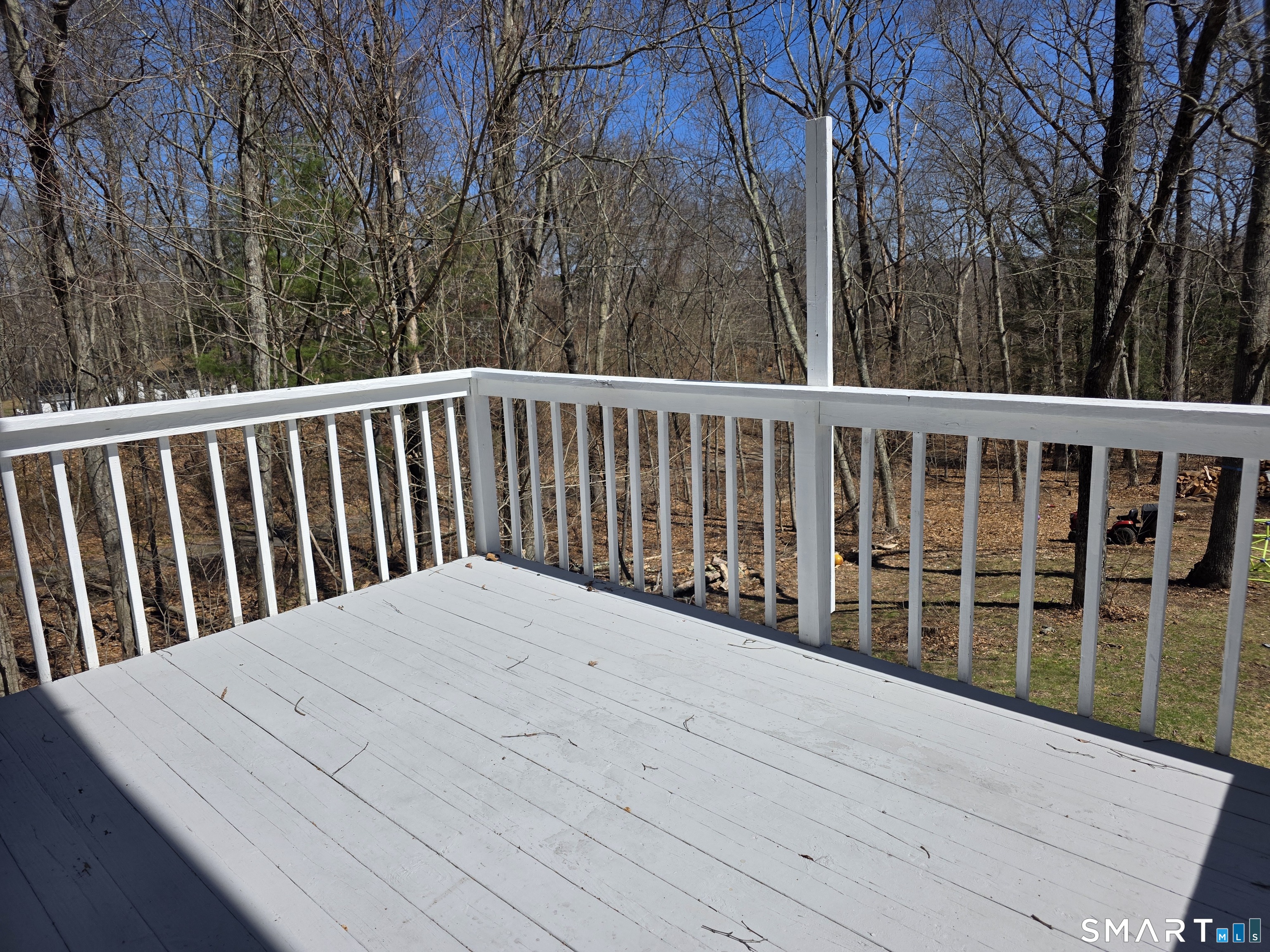 259 Westchester Road, Unit A Colchester, CT 06415 - Photo 22 of 22 a balcony with wooden floor and fence