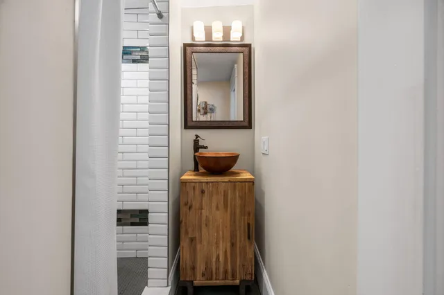a bathroom with a sink and a mirror
