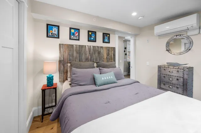 a bedroom with a bed and a dresser