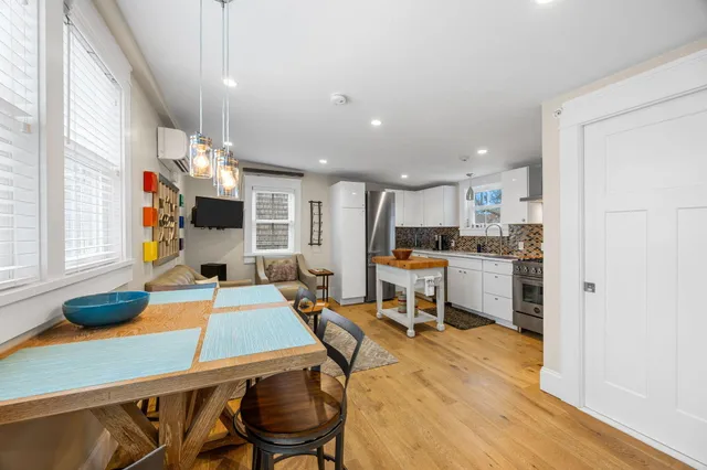 a kitchen with stainless steel appliances kitchen island granite countertop a sink and cabinets