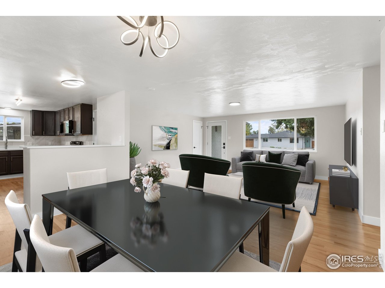 1245 Sumner Street Longmont, CO 80501 - Photo 14 of 25 a view of a dining room with furniture and wooden floor