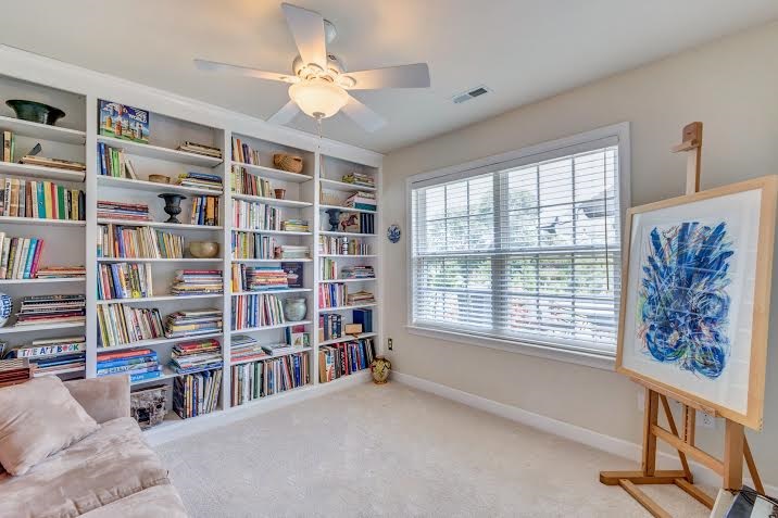102 West Ridge Court Keswick, VA 22947 - Photo 14 of 35 a livingroom with a bookshelf and a large window