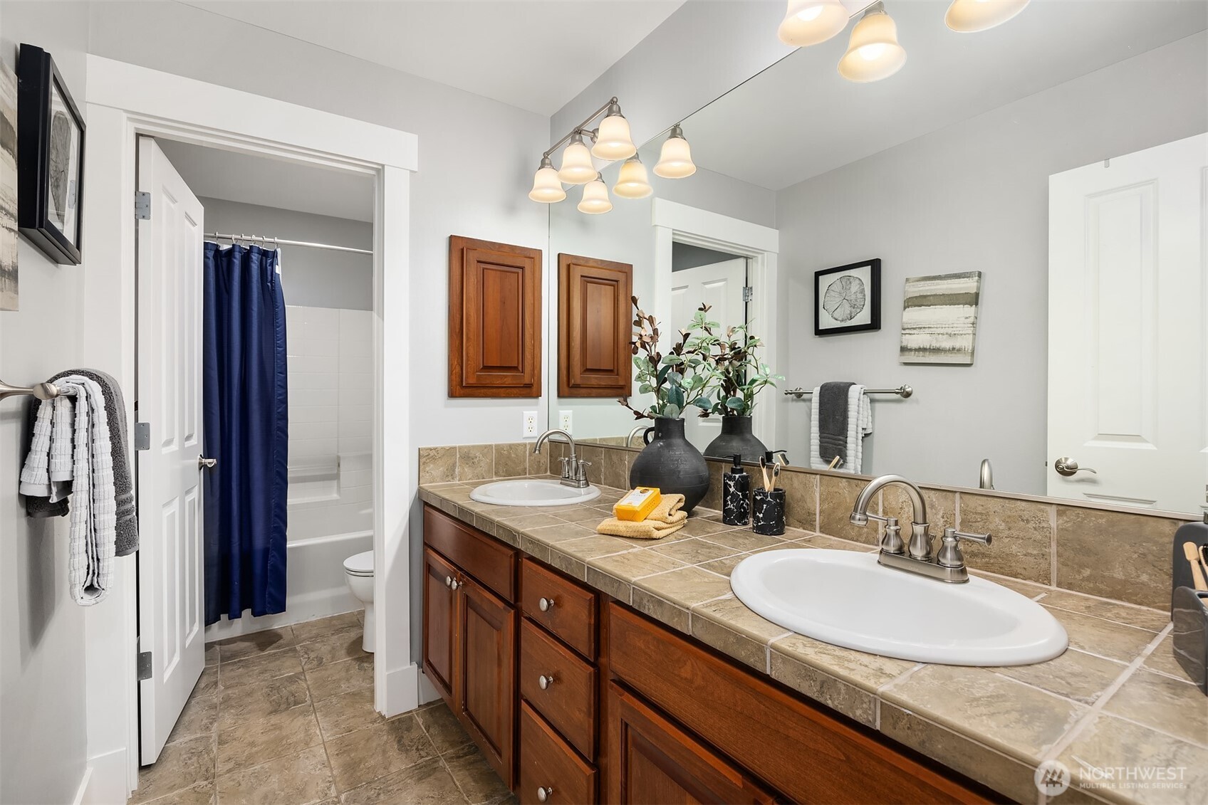 2989 Northeast Davis Loop Issaquah, WA 98029 - Photo 31 of 40 a bathroom with a granite countertop sink and a mirror