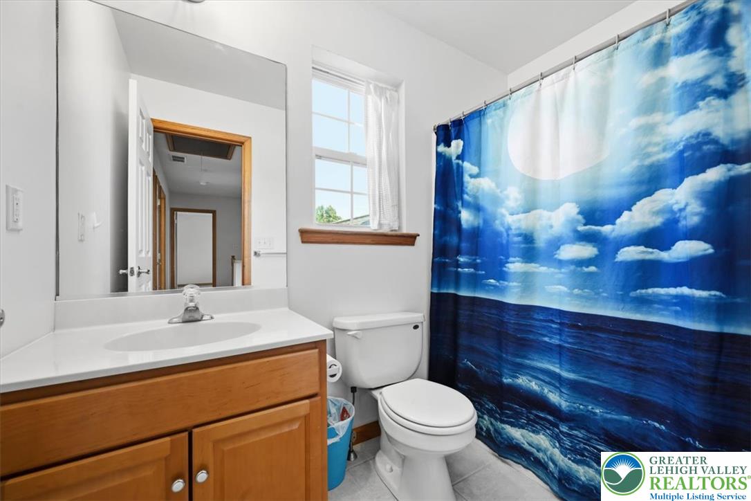 66 Labar Road Bangor, PA 18013 - Photo 37 of 56 A well-maintained bathroom featuring a practical vanity and bright window provides daily comfort.