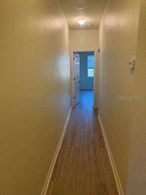 8145 Serenity Spring Drive, Unit GE Windermere, FL 34786 - Photo 12 of 31 a view of a hallway with wooden floor