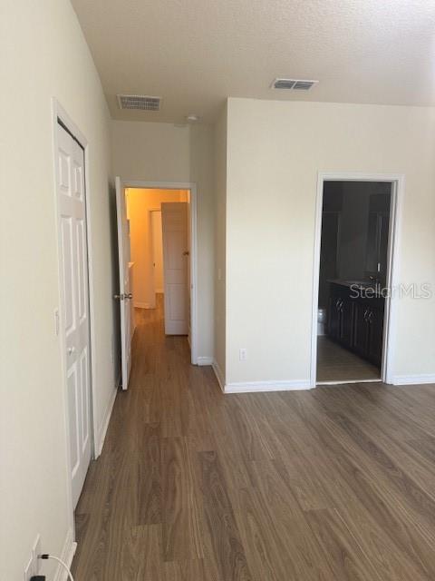 8145 Serenity Spring Drive, Unit GE Windermere, FL 34786 - Photo 14 of 31 a view of a hallway with wooden floor