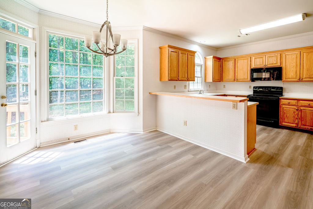 115 Monte Ridge Way Fayetteville, GA 30215 - Photo 11 of 32 a view of large kitchen with granite countertop stainless steel appliances and stove