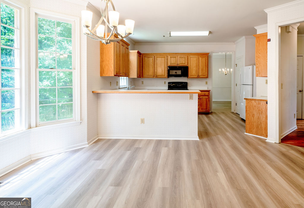 115 Monte Ridge Way Fayetteville, GA 30215 - Photo 12 of 32 a view of kitchen with cabinets and wooden floor