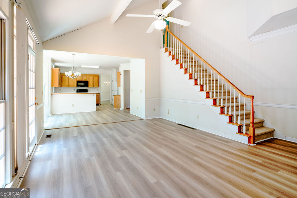 115 Monte Ridge Way Fayetteville, GA 30215 - Photo 13 of 32 a view of a hallway view with wooden floor and staircase