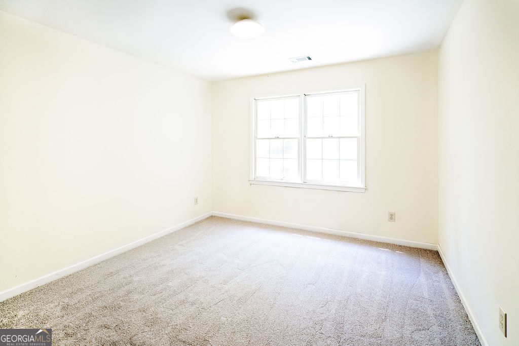 115 Monte Ridge Way Fayetteville, GA 30215 - Photo 22 of 32 an empty room with a window