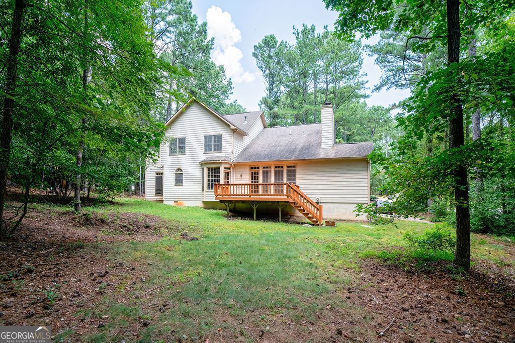 115 Monte Ridge Way Fayetteville, GA 30215 - Photo 29 of 32 a view of a house with a yard