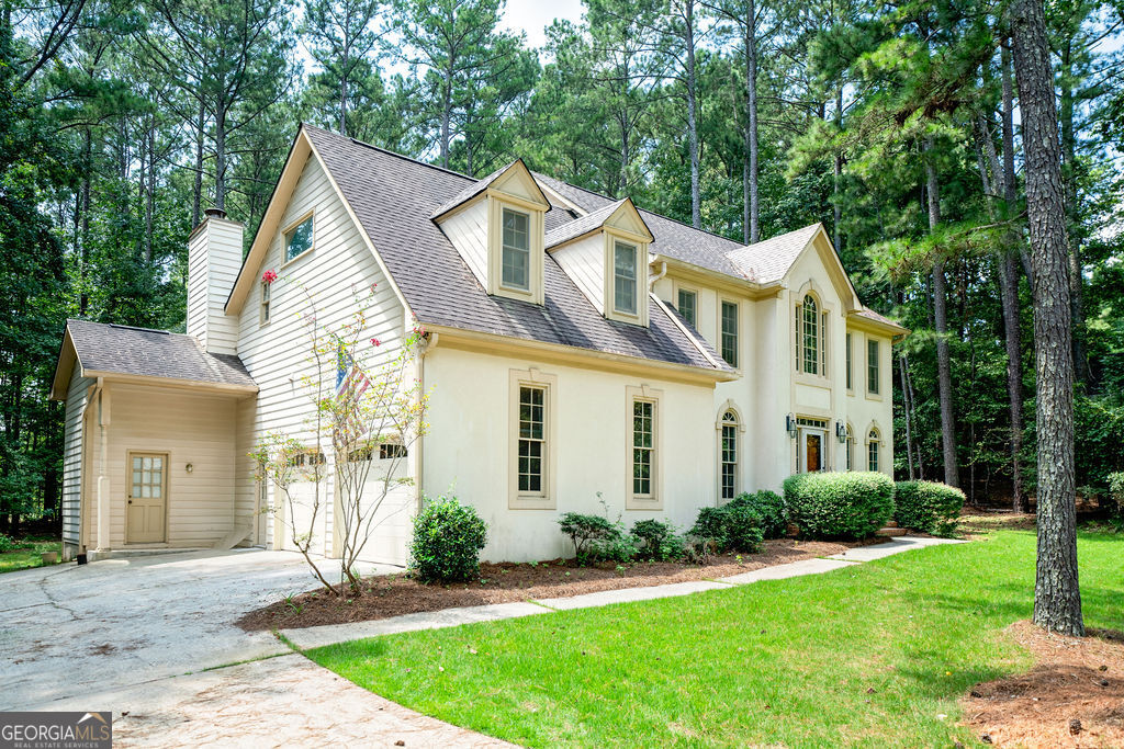 115 Monte Ridge Way Fayetteville, GA 30215 - Photo 3 of 32 a front view of a house with a yard and potted plants