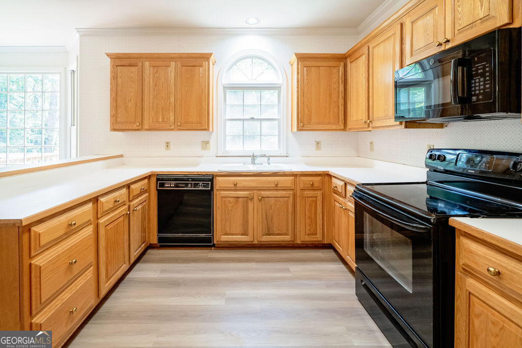 115 Monte Ridge Way Fayetteville, GA 30215 - Photo 9 of 32 a kitchen with stainless steel appliances granite countertop a stove cabinets and a sink