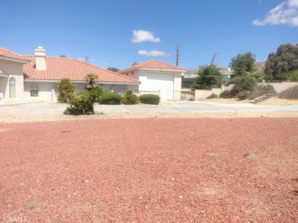 20305 Rancherias Road Apple Valley, CA 92307 - Photo 6 of 6 Side / with garage