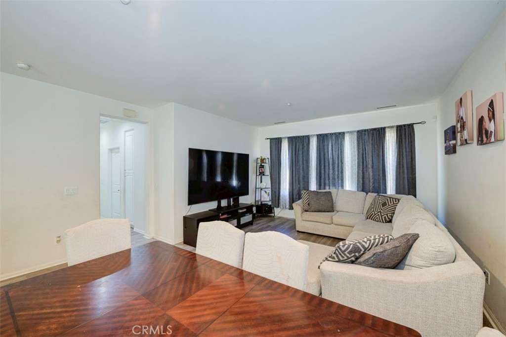 2071 Atlantic Avenue Long Beach, CA 90806 - Photo 8 of 15 a living room with furniture and a flat screen tv