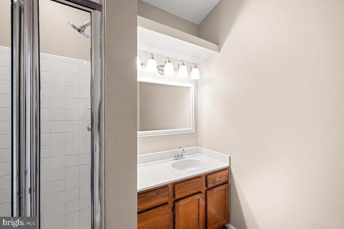 144 Forests Edge Place Laurel, MD 20724 - Photo 14 of 31 a bathroom with a sink and a mirror
