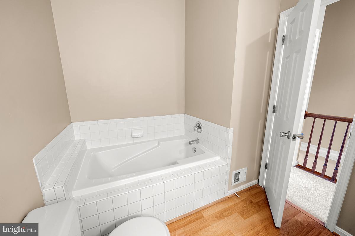 144 Forests Edge Place Laurel, MD 20724 - Photo 15 of 31 a bathroom with a tub toilet and sink