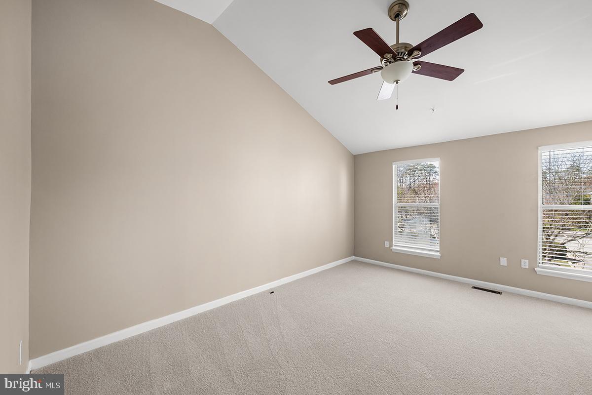 144 Forests Edge Place Laurel, MD 20724 - Photo 17 of 31 an empty room with a window and a fan