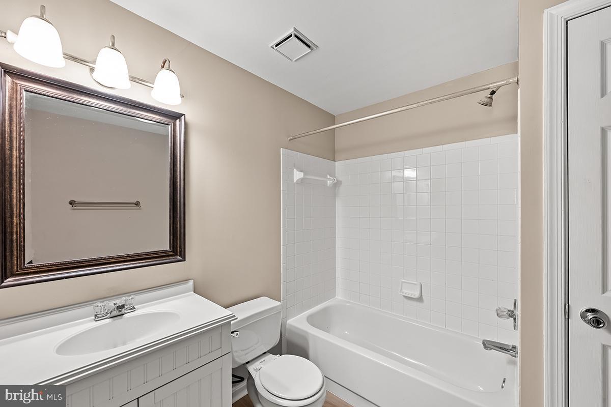 144 Forests Edge Place Laurel, MD 20724 - Photo 24 of 31 a bathroom with a bathtub shower sink vanity and toilet