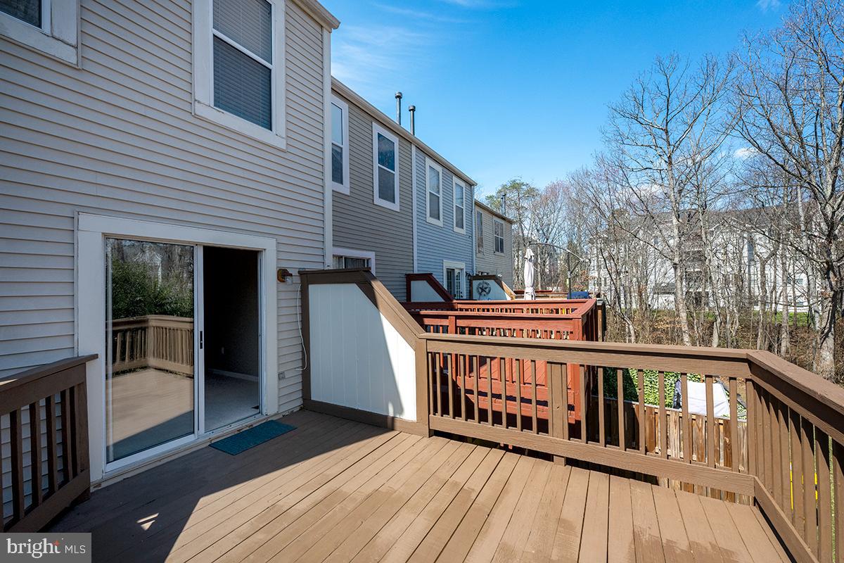 144 Forests Edge Place Laurel, MD 20724 - Photo 27 of 31 a view of a house with wooden deck