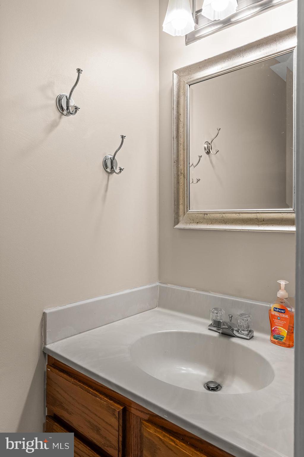 144 Forests Edge Place Laurel, MD 20724 - Photo 5 of 31 a bathroom with a sink and vanity