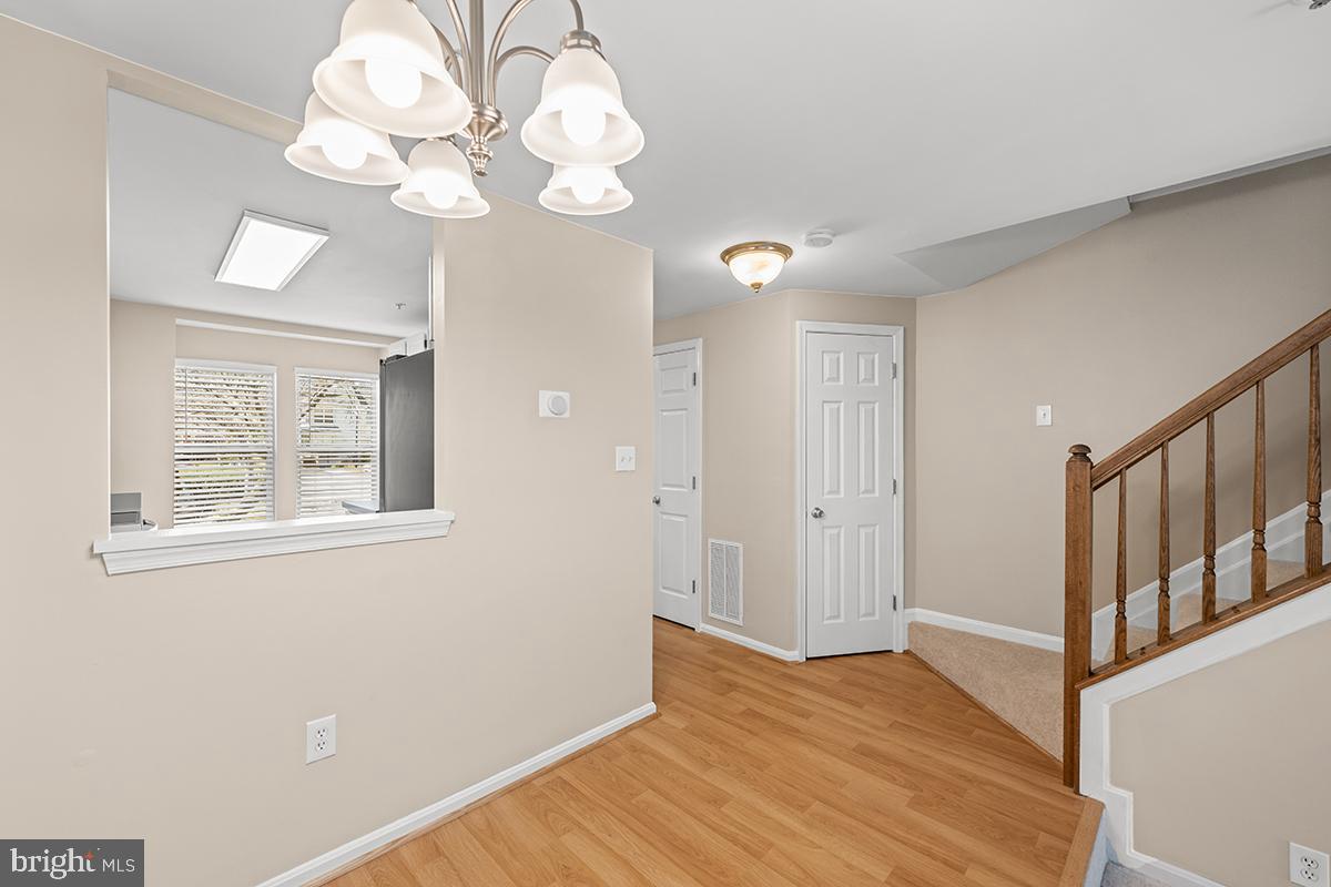 144 Forests Edge Place Laurel, MD 20724 - Photo 7 of 31 a view of an empty room with wooden floor