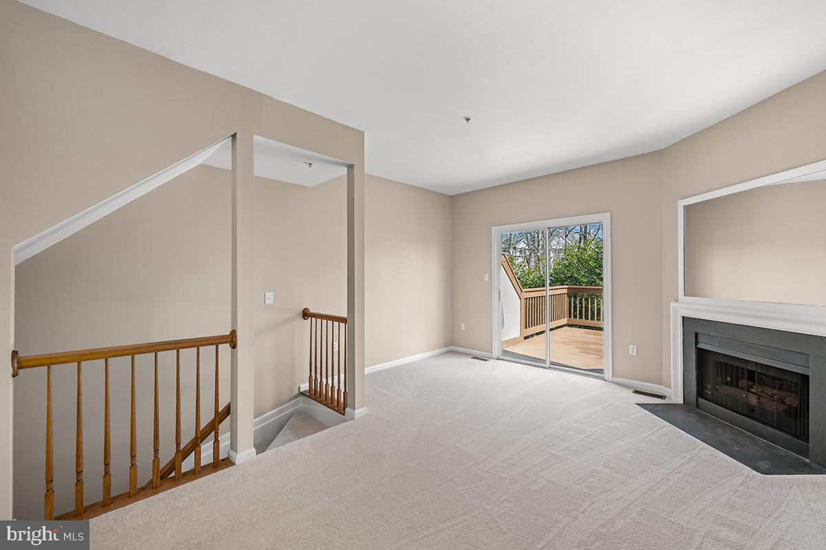 144 Forests Edge Place Laurel, MD 20724 - Photo 9 of 31 a view of a livingroom with an empty space and a fireplace