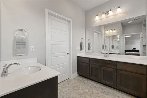 a bathroom with a shower and vanity