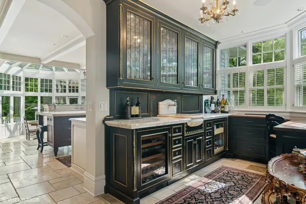 a kitchen with a stove a sink and a cabinets