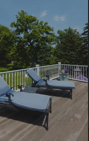 a view of balcony with wooden floor and outdoor seating