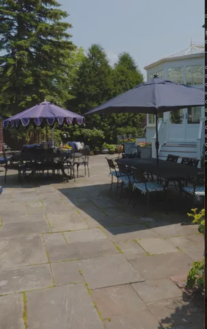 a patio with table and chairs