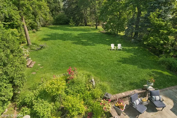 aerial view of a house with a yard