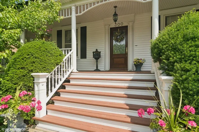 a view of a house with potted plants