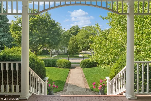 a view of a garden and deck