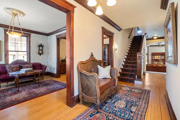a living room with furniture and wooden floor
