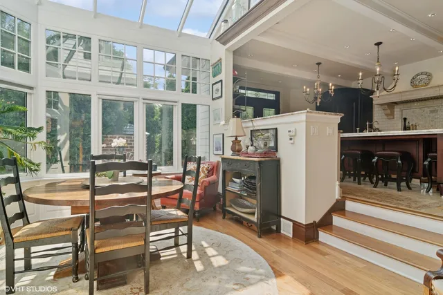a dining room with furniture and a fireplace